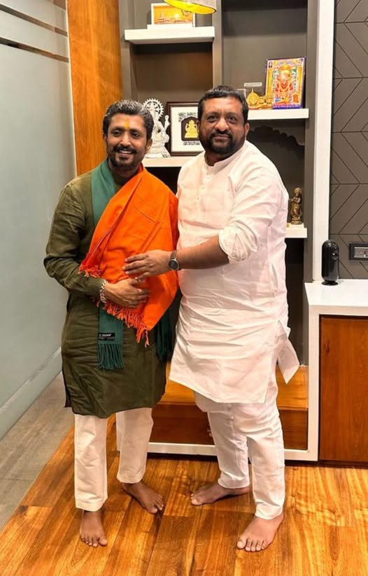 May be an image of 2 people and text